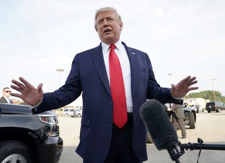 U.S. President Donald Trump speaks to reporters after arriving at Pitt-Greenville Airport in Greenville