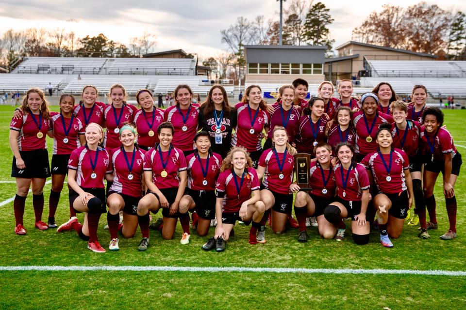 The Vassar College women's rugby team poses with its medals and championship plaque after winning a Division II national championship last Saturday.