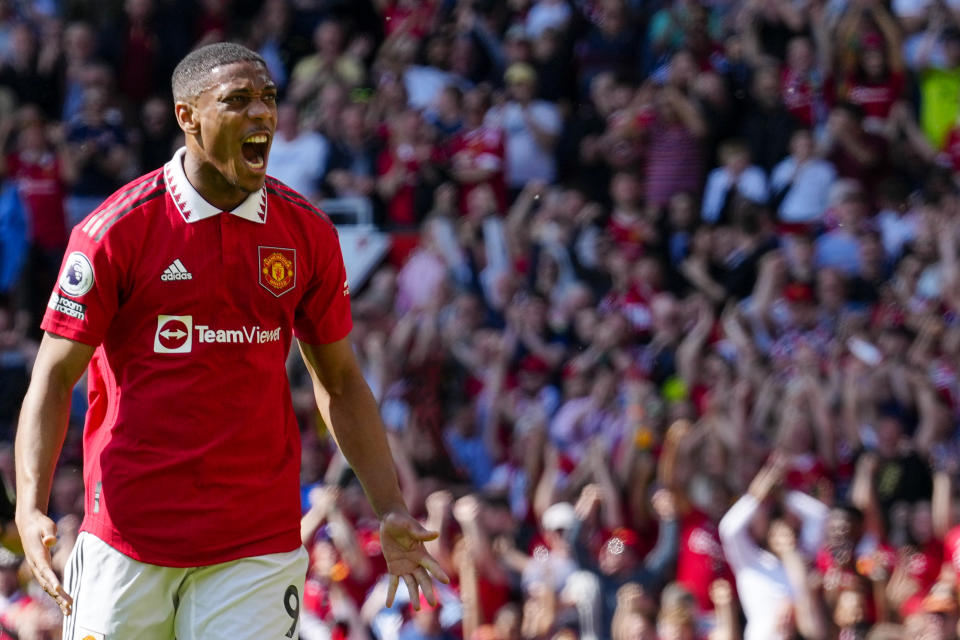 Manchester United's Anthony Martial celebrates after scoring his side's opening goal during the English Premier League soccer match between Manchester United and Wolverhampton at the Old Trafford stadium in Manchester, England, Saturday, May 13, 2023. (AP Photo/Jon Super)