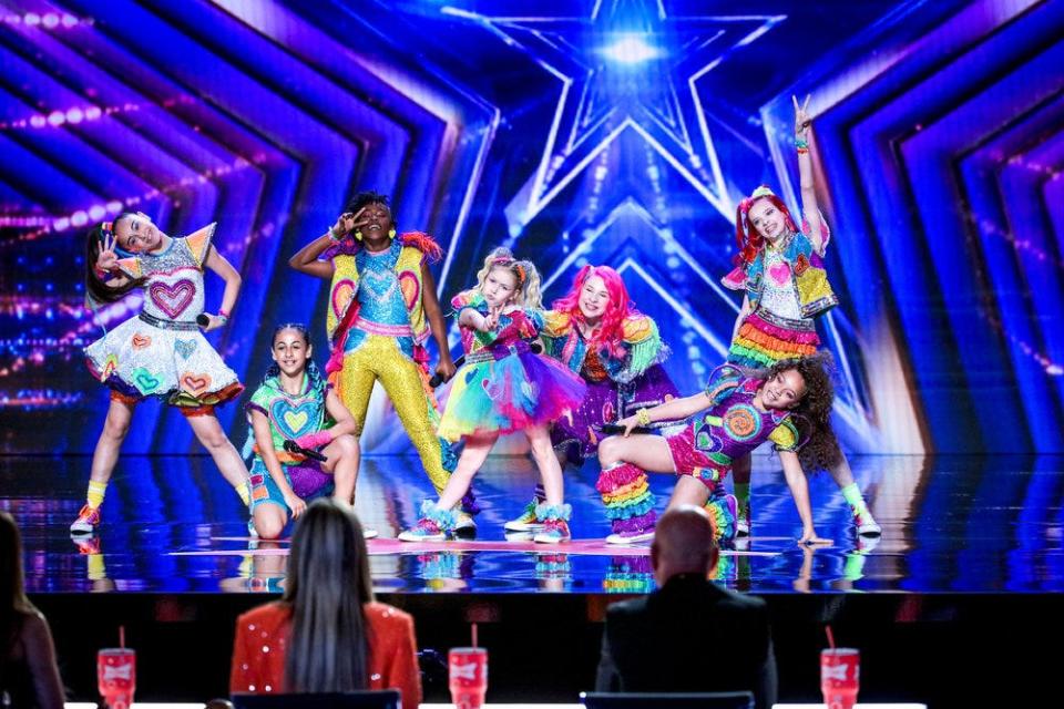 Girl group XOMG Pop! brings their sugary pop magic to the Season 17 premiere of "America's Got Talent" on May 31, 2022, performing their infectious song “Candy Hearts. The seven-member group is the protégé of Jojo Siwa, who formed XOMG Pop! with her mother Jessalynn Siwa.