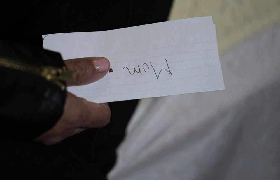 Irma Reyes holds a note from her daughter at her South Texas home, Wednesday, Feb. 1, 2023. Reyes feels like "collateral damage" in the plea deal that let the two men charged with sex trafficking her teenage daughter walk free. (AP Photo/Eric Gay)
