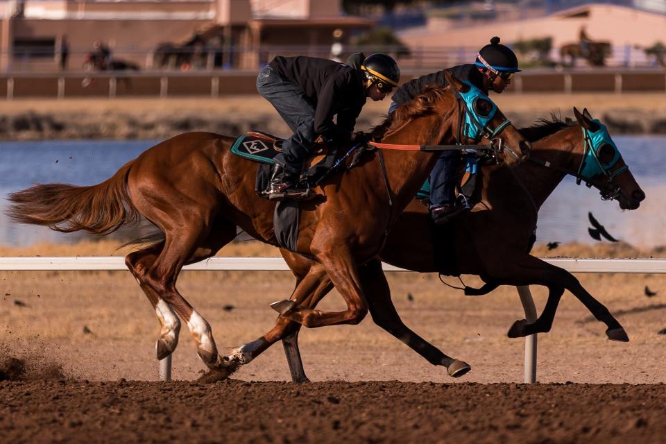 El Paso jockey Luis Fuentes and jockey Christian Ramos gallop horses at the Sunland Park Racetrack on Tuesday, March 21, 2023.