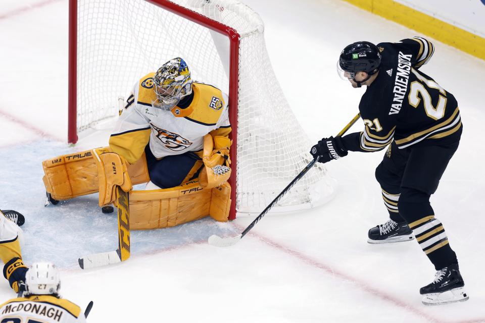 Boston Bruins' James van Riemsdyk (21) scores on Nashville Predators' Juuse Saros during the first period of an NHL hockey game, Saturday, Oct. 14, 2023, in Boston. (AP Photo/Michael Dwyer)