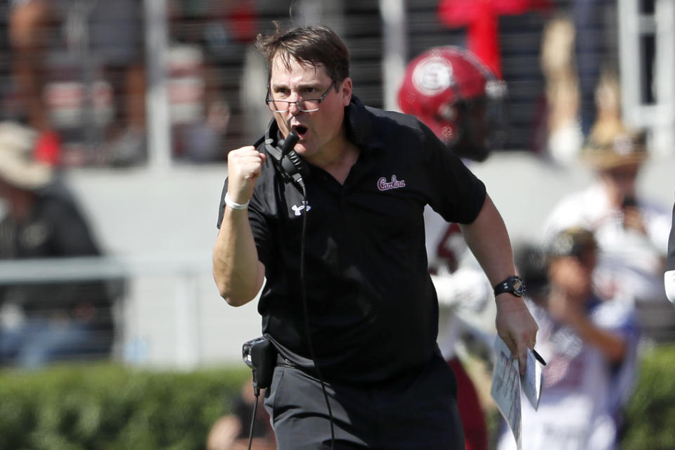 South Carolina head coach Will Muschamp reacts after his team returned an interception of a touchdown in the first half of an NCAA college football game against Georgia, Saturday, Oct. 12, 2019, in Athens, Ga. (AP Photo/John Bazemore)