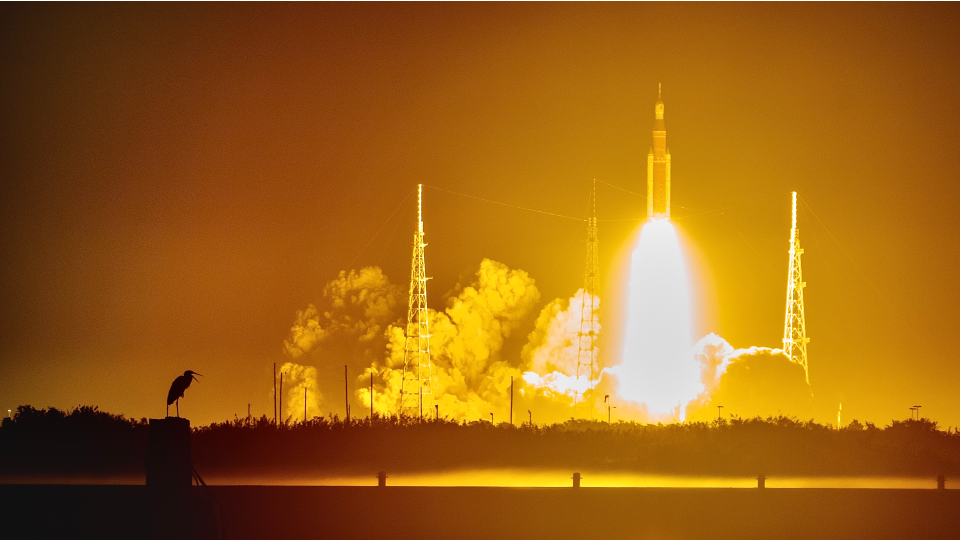 The launch of the Artemis 1 Space Launch System rocket, seen from the press conference at Kennedy Space Center.