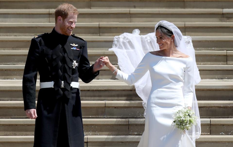 Prince Harry and Meghan Markle hold hands after their wedding