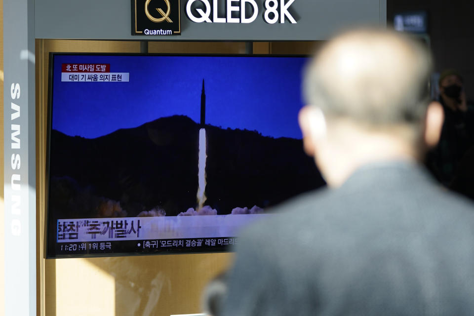 A man watches a TV screen showing a news program reporting about North Korea's missile launch with a file image, at a train station in Seoul, South Korea, Monday, Jan. 17, 2022. North Korea on Monday fired two suspected ballistic missiles into the sea in its fourth weapons launch this month, South Korea's military said, with the apparent goal of demonstrating its military might amid paused diplomacy with the United States and pandemic border closures. (AP Photo/Lee Jin-man)