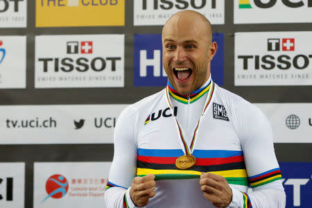 Cycling - UCI Track World Championships - Men's Sprint, Final - Hong Kong, China – 15/4/17 - Russia's Denis Dmitriev poses with gold medal. REUTERS/Bobby Yip