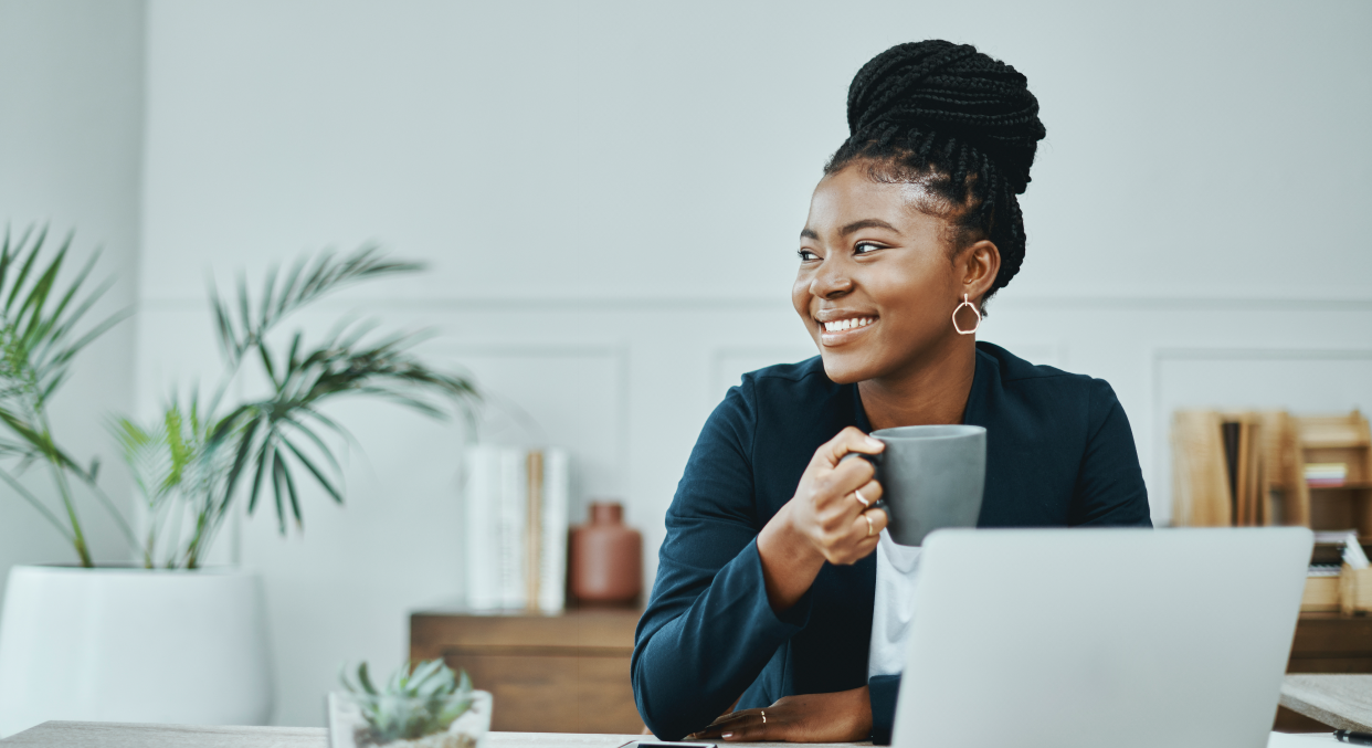 Woman having a tea break while working