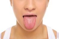 <b>2. Get that tongue clean!</b> A lot of us neglect our tongue while brushing, which won’t help when it comes to preventing bad breath. According to Dr. Katz in <a href="http://www.therabreath.com/white-tongue.html" rel="nofollow noopener" target="_blank" data-ylk="slk:TheraBreath website;elm:context_link;itc:0;sec:content-canvas" class="link ">TheraBreath website</a>, "Not only does a coated tongue look abnormal, but if left untreated, it’s a strong indication of a breath problem.” Also, gunk on the surface of your tongue is also a good food source for the bacteria in your mouth, which increases your risk of having bad breath. To clean your tongue, use a tongue cleaner or a scraper and sweep against the surface of the tongue, moving from the back to the front. Apply a gentle pressure (not too hard or you’ll injure your tongue!), and repeat the process at least twice.