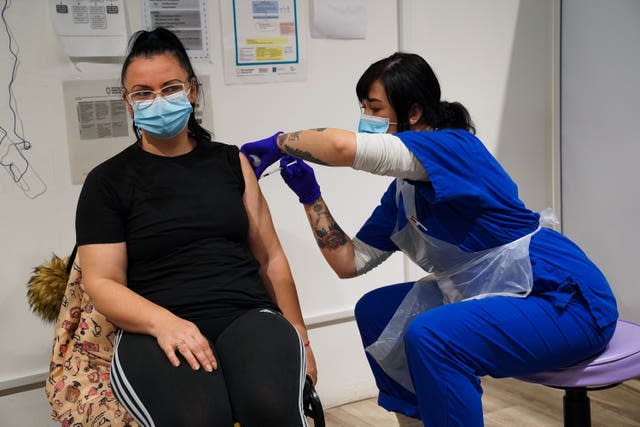 A woman receives a jab at the vaccination centre