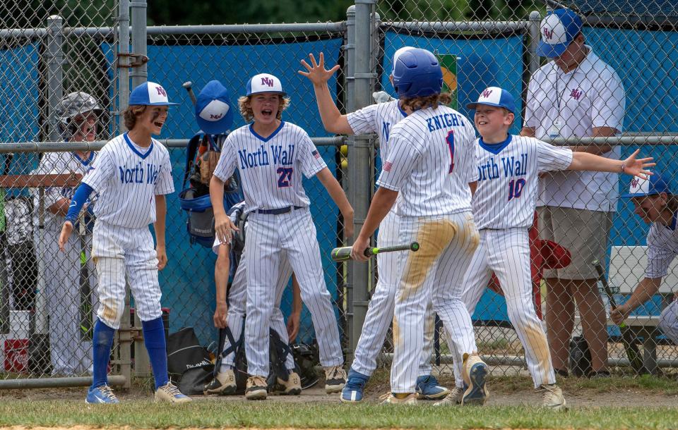 North Wall's Chris Knight (#1) celebrates after scoring a run. North Wall Little League defeats South Wall 14-6 in District 11 Championship game in Wall NJ on July 9, 2022.