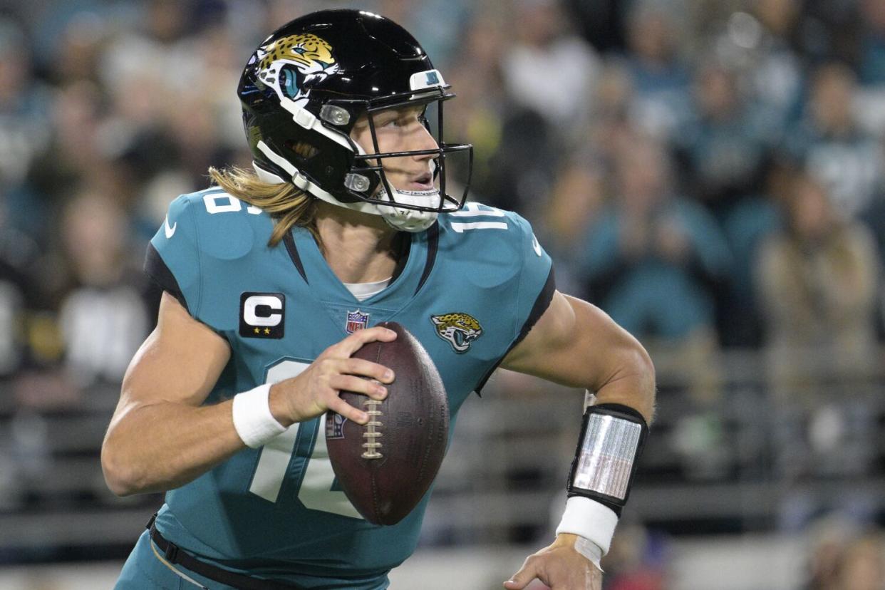 Jacksonville Jaguars quarterback Trevor Lawrence scrambles against the Tennessee Titans last Saturday.