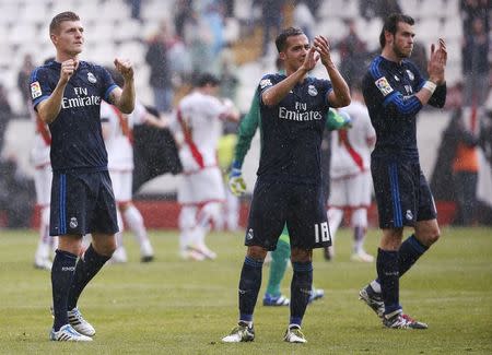 Football Soccer - Spanish Liga BBVA - Rayo Vallecano v Real Madrid - Vallecas stadium, Madrid, Spain - 23/04/16 (L-R) Real Madrid's Toni Kroos, Lucas Vazquez and Gareth Bale celebrate the victory after the match. REUTERS/Sergio Perez