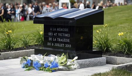 A memorial monument is pictured after a memorial mass at the Sainte-Agnes church in Lac-Megantic, July 6, 2014. REUTERS/Mathieu Belanger