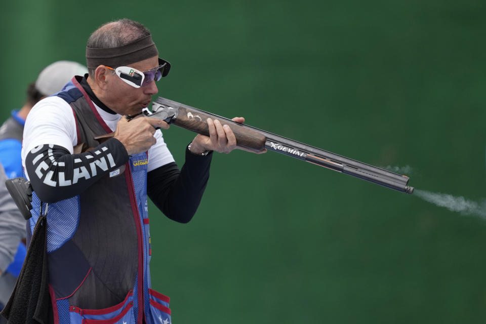 FILE - Venezuela's Leonel Martinez competes in the men's shooting trap final at the Pan American Games in Santiago, Chile, Oct. 27, 2023. Martinez was only 20 years old when he took part in the Los Angeles Games in 1984, but says he’s in better shape now, at 60, as he prepares to compete in Paris after the second-longest gap between Olympic appearances in history. (AP Photo/Moises Castillo, File)