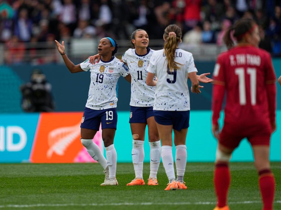 Crystal Dunn (left) and Sophia Smith react to an offside call.