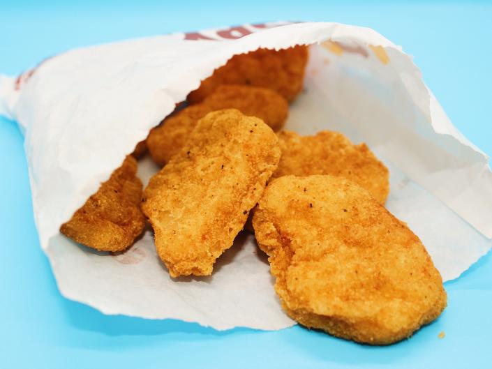 A white paper bag with 10 chicken nuggets