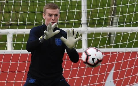 England's goalkeeper Jordan Pickford attends an England team training session at St George's Park  - Credit: PAUL ELLIS/AFP/Getty Images
