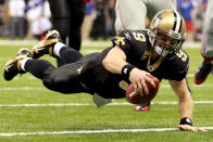 NEW ORLEANS, LA - NOVEMBER 28: Drew Brees #9 of the New Orleans Saints dives into the endzone for a touchdown against the New York Giants at Mercedes-Benz Superdome on November 28, 2011 in New Orleans, Louisiana. (Photo by Ronald Martinez/Getty Images)