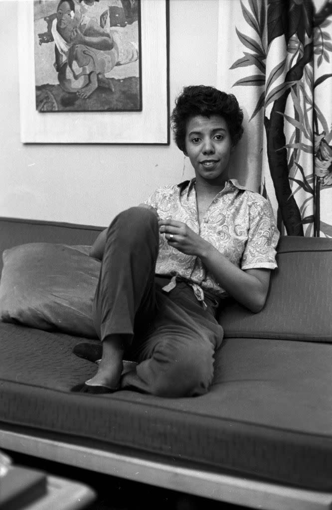 <p>Playwright Lorraine Hansberry, the first Black woman to have her play (<em>A Raisin in the Sun</em>) performed on Broadway<em>,</em> reclines in her Bleecker Street apartment. Today, the home is listed in the <a href="https://www.nps.gov/places/lorraine-hansberry-residence.htm" rel="nofollow noopener" target="_blank" data-ylk="slk:National Register of Historic Places;elm:context_link;itc:0;sec:content-canvas" class="link ">National Register of Historic Places</a>.</p>