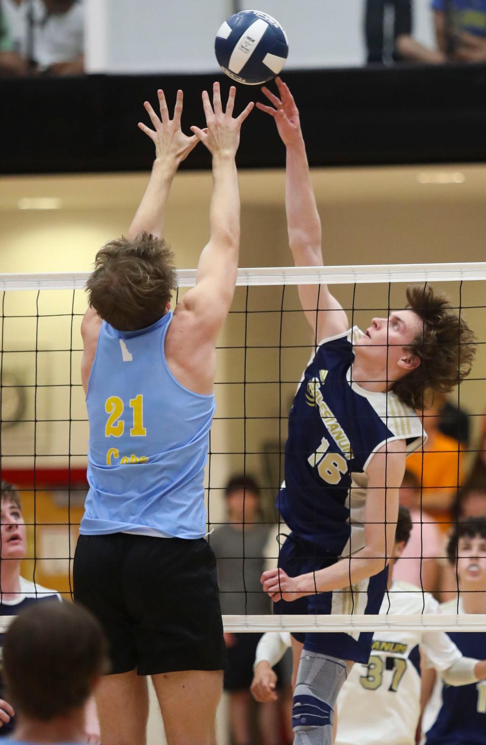Salesianum's Christian Sullivan (16) goes for a kill against Cape Henlopen's Dylan Henry in the second game of Cape Henlopen's 3-0 win for the first DIAA state title earned in boys volleyball, Tuesday, May 23, 2023 at Smyrna High School.