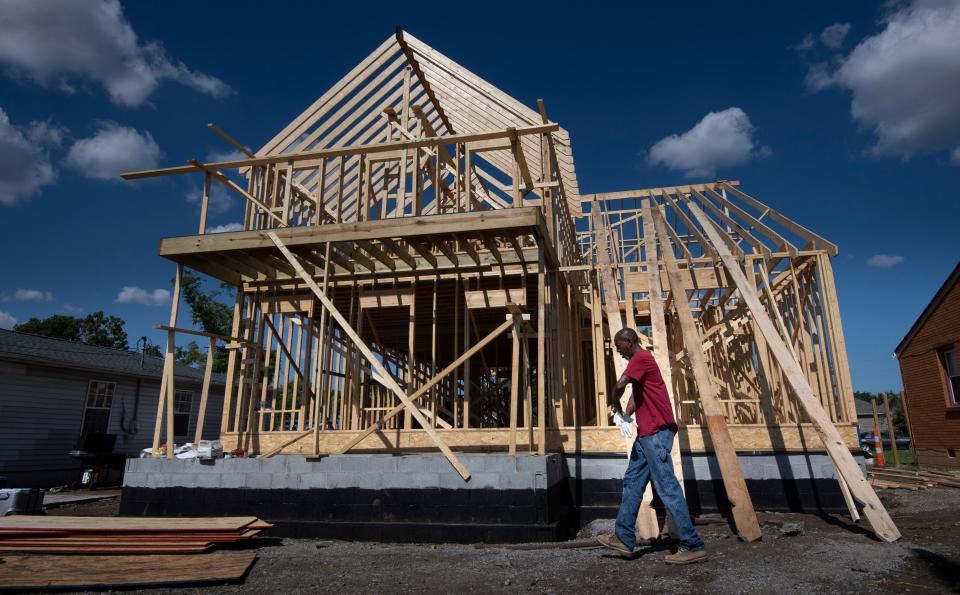 Sam Brown walks past his home as he rebuilds on Monday, Aug. 17, 2020 in Nashville, Tenn.