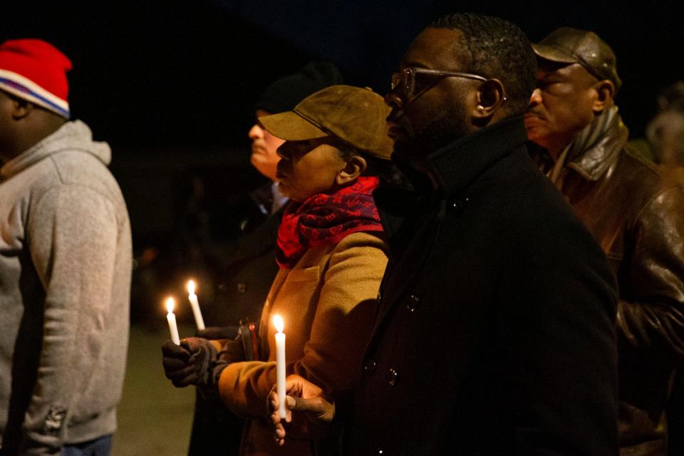 Memphis Police Chief Cerelyn “C.J” Davis and Mayor Paul Young hold candles during a candlelight vigil for Tyre Nichols held at the site where he was beaten to death by Memphis Police Department officers on the one year anniversary of his death in Memphis, Tenn., on Sunday, January 7, 2024.