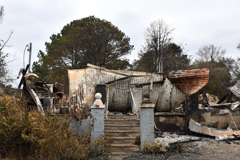 The burnt out remains of a house is seen from a bushfire in the Southern Highlands town of Wingello, 160km south west of Sydney. Source: AAP Image