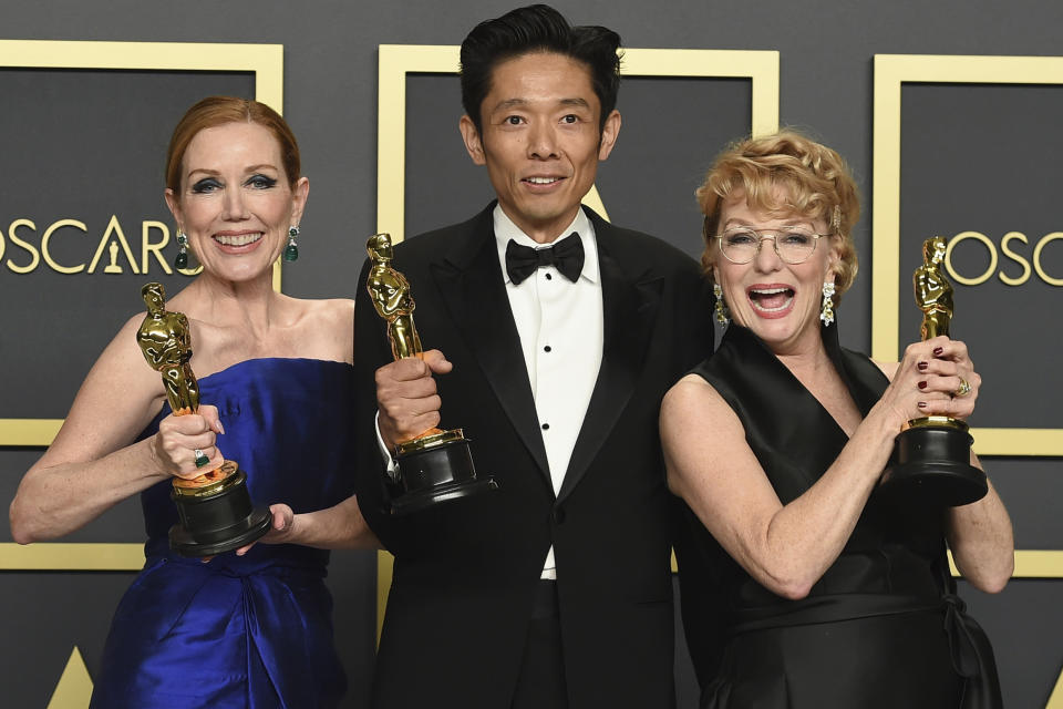 Anne Morgan, from left, Kazu Hiro, and Vivian Baker, winners of the award for best makeup and hairstyling for "Bombshell", pose in the press room at the Oscars on Sunday, Feb. 9, 2020, at the Dolby Theatre in Los Angeles. (Photo by Jordan Strauss/Invision/AP)