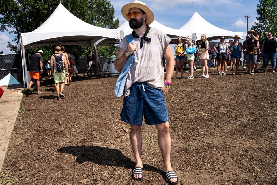 Garrett Cornelison, a Des Moines native, dons his custom designed "Keep Des Moines Boring" shirt during Saturday's Hinterland Music Festival in St. Charles.