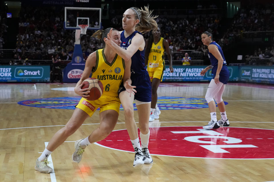 Australia's Steph Talbot, left, runs into Serbia's Ivana Raca during their game at the women's Basketball World Cup in Sydney, Australia, Sunday, Sept. 25, 2022. (AP Photo/Mark Baker)