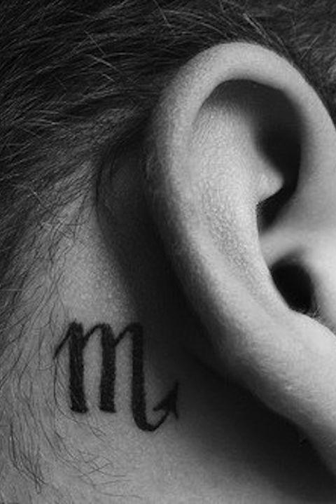 aries symbol tattoo behind ear