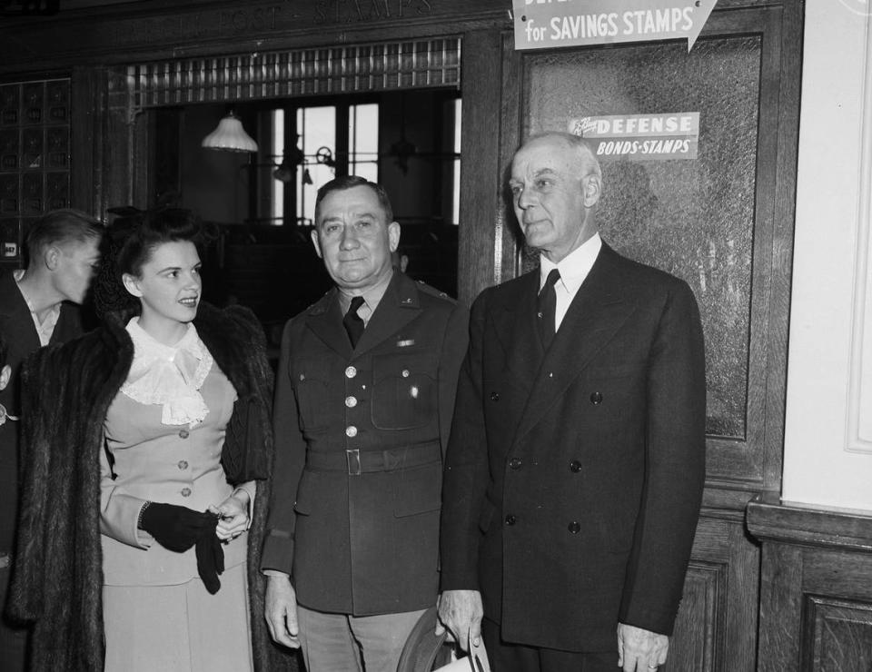 Jan. 30, 1942: Movie star Judy Garland is in Mineral Wells, Texas, to visit Camp Wolters and appear in a USO show. The famous “Wizard of Oz” actress poses with Brigadier General Emil F. Reinhart, center, and Mayor J.C. Miller. Garland led a parade of 2,000 school children to the post office to purchase defense stamps. Date Created: 1942-01-30 Fort Worth Star-Telegram archives/UT Arlington Special Collections