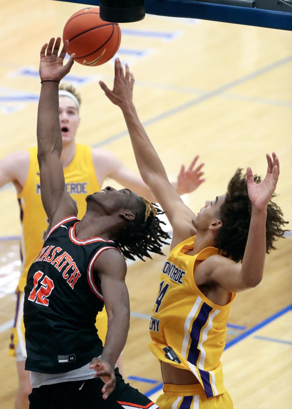 Wasatch Academy’s Chris Nwuli and Montverde Academy’s Asa Newell reach for the ball during a National Hoopfest Utah Tournament game at Pleasant Grove High School in Pleasant Grove on Monday, Nov. 20, 2023. Montverde won 88-53. | Kristin Murphy, Deseret News