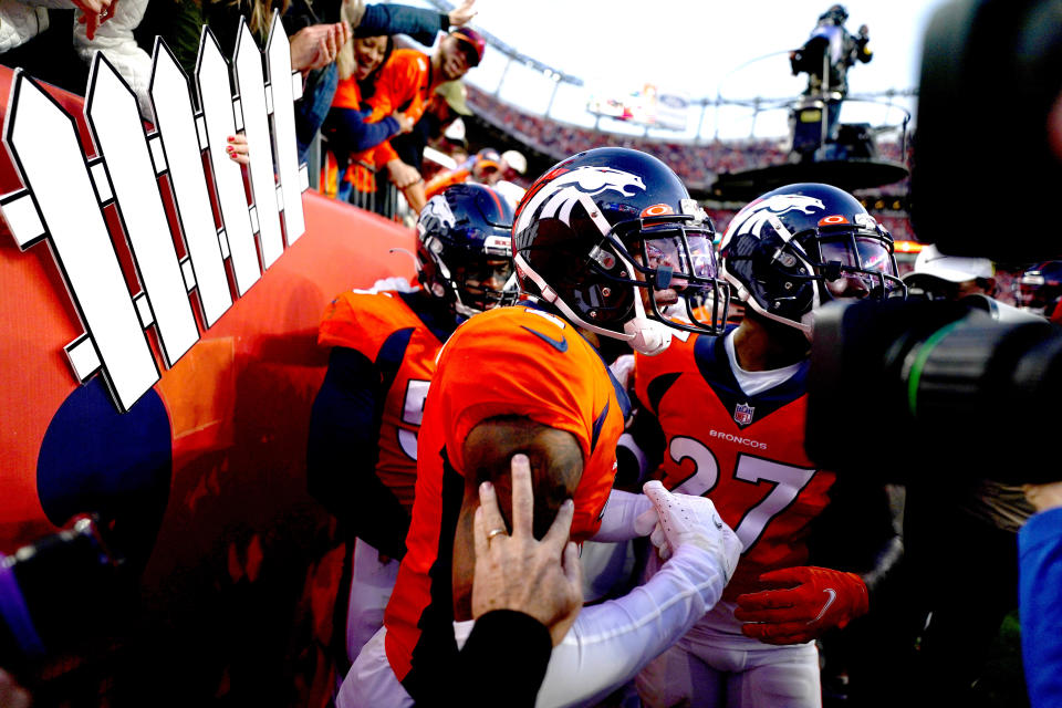 Denver Broncos cornerback Pat Surtain II, center, celebrates his interception against the Los Angeles Chargers during the second half of an NFL football game, Sunday, Nov. 28, 2021, in Denver. (AP Photo/Jack Dempsey)