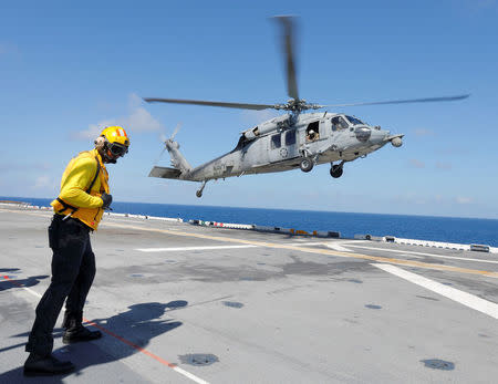 A Navy MH-60S Sea Hawk lands on the USS Kearsarge as the evacuation of U.S. military personnel from the U.S. Virgin Islands continues in advance of Hurricane Maria, in the Caribbean Sea near the islands September 18, 2017. REUTERS/Jonathan Drake