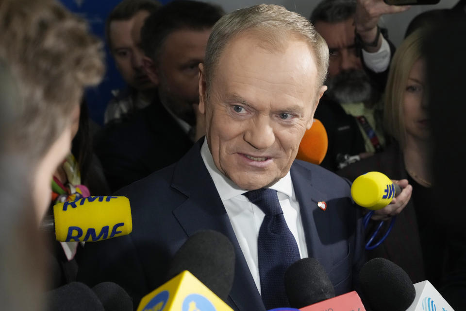 Polish opposition leader Donald Tusk speaks with reporters after the signing ceremony of a coalition agreement that he sealed with the leaders of other parties, in Warsaw, Poland, on Friday Nov. 10, 2023. The leaders of Polish opposition parties have signed a coalition agreement that lays out a roadmap for governing the nation over the next four years. (AP Photo/Czarek Sokolowski)