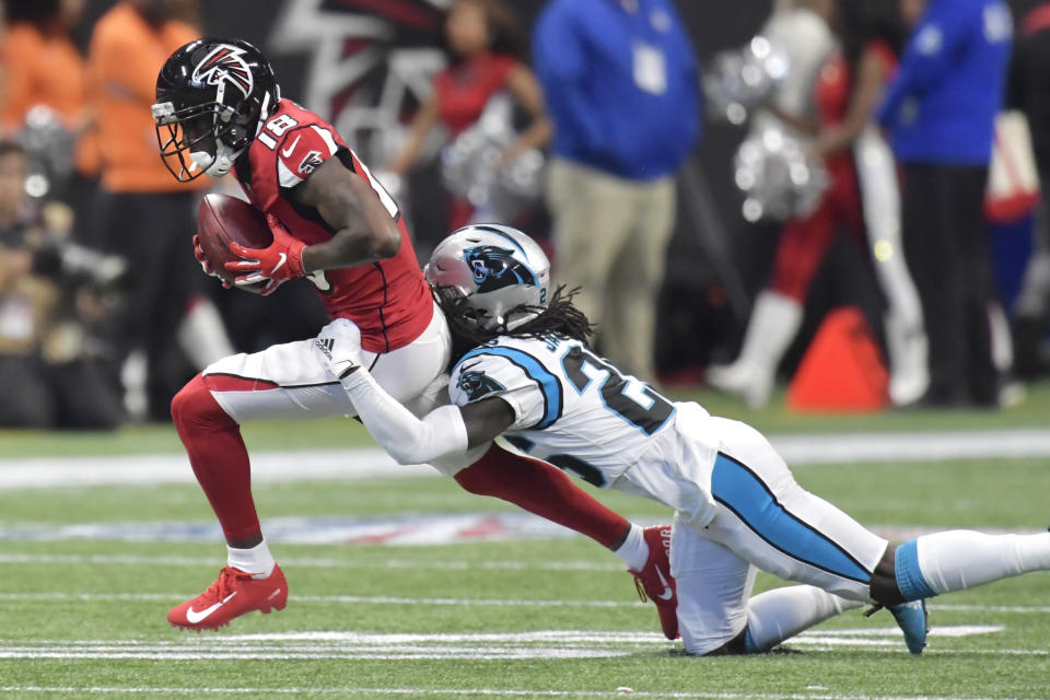 Carolina Panthers strong safety Eric Reid (25) hits Atlanta Falcons wide receiver Calvin Ridley (18) during the first half of an NFL football game, Sunday, Dec. 8, 2019, in Atlanta. (AP Photo/Mike Stewart)