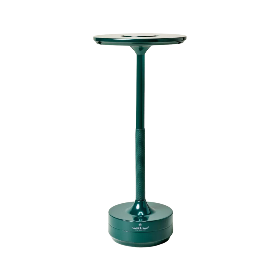 A green portable table lamp