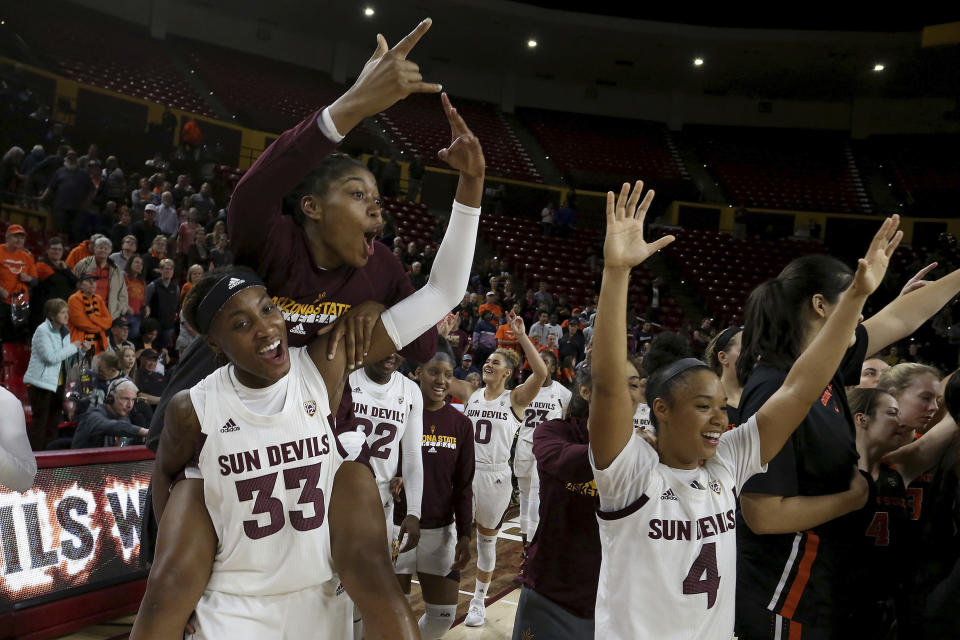 Arizona State players celebrate their upset win over Oregon State at the end of an NCAA college basketball game Sunday, Jan. 12, 2020, in Tempe, Ariz. (AP Photo/Darryl Webb)