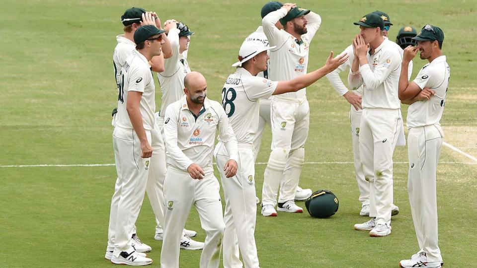 Australian players, pictured here reacting to replays of the controversial DRS call.