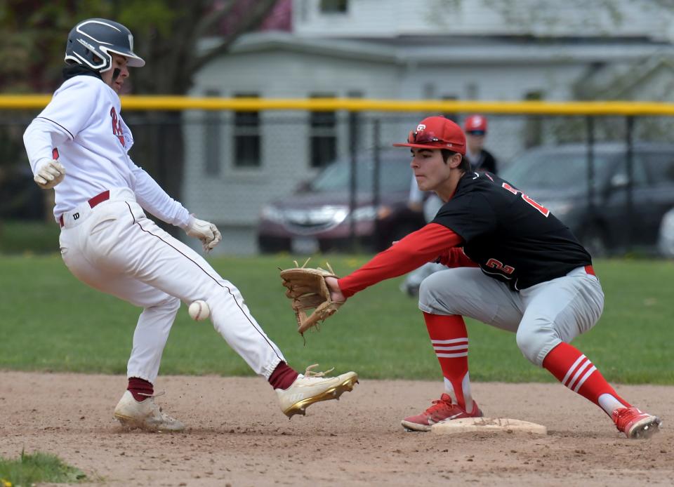 Westborough's Enzo Micucci gets back to second base safely, as the ball hits him on the leg, on an attempted pickoff throw from St. John's catcher Pat McManus to shortstop Andrew Gardner.