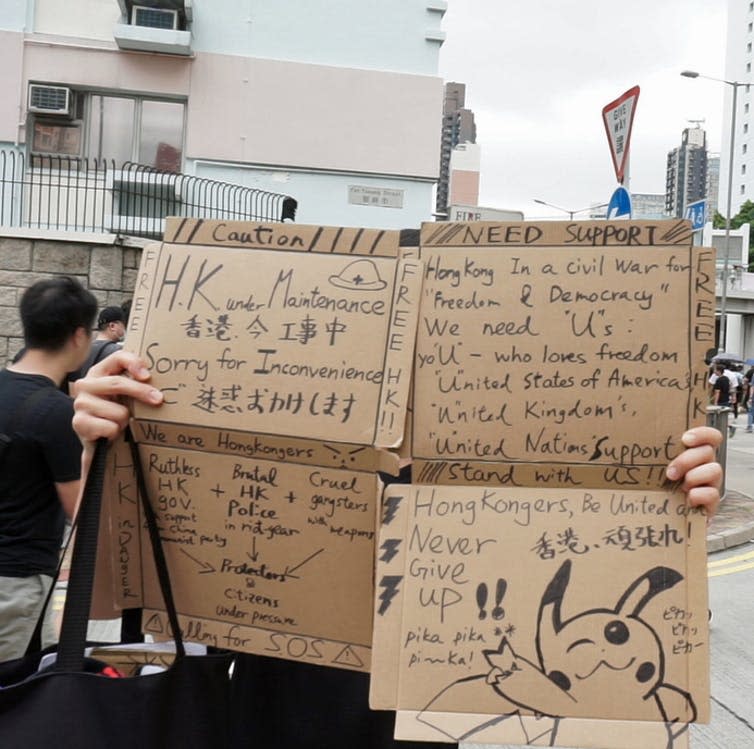 <span class="caption">Signs held up during the Sham Shui Po rally.</span> <span class="attribution"><span class="source">Malte Philip Kaeding</span>, <span class="license">Author provided</span></span>