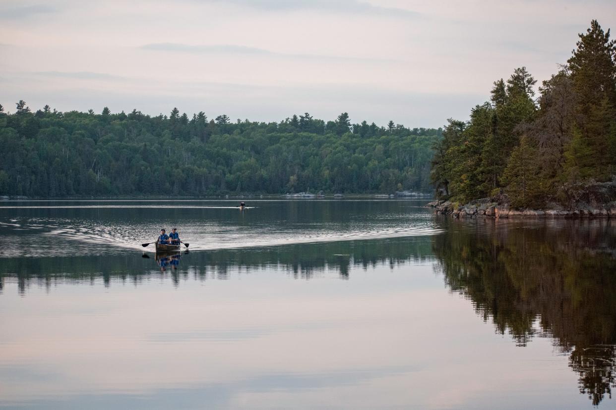 Two paddlers canoe on Boot Lake in the Boundary Waters Canoe Area Wilderness in September 2023. The wilderness area is a popular spot for canoe trips as well as other forms of recreation that bring in more than 150,000 visitors each year.