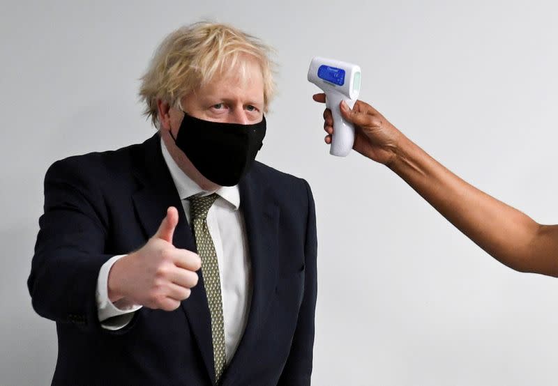 Britain's Prime Minister Boris Johnson visits the Chase Farm Hospital in north London