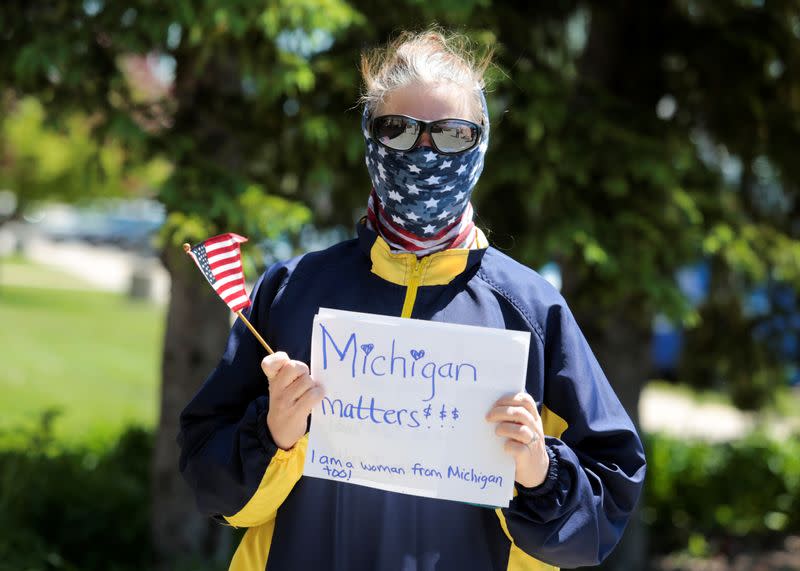A resident shows her support for Governor Gretchen Whitmer during the flooding along the Tittabawassee River, after several dams breached, in Midland