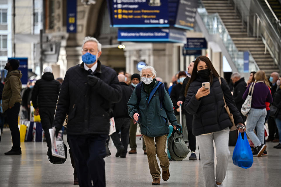 LONDON, ENGLAND - FEBRUARY 23: Commuters are seen in Waterloo station on February 23, 2022 in London, England. Transport for London, the government body responsible for most of the transport network in the capital, announced that, from tomorrow, it will not require passengers to wear face coverings as a condition of carriage on buses and in the Tube. England is dropping all remaining legal requirements related to Covid-19 as of tomorrow. (Photo by Jeff J Mitchell/Getty Images)