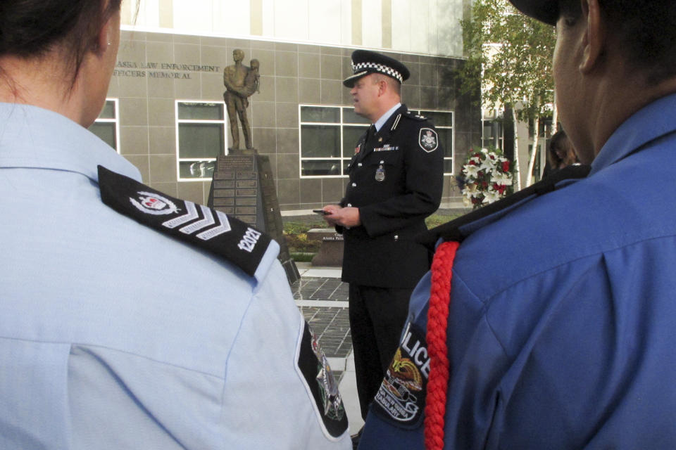 Superintendent Conrad Jensen of the Australian Federal Police speaks at a police remembrance ceremony Friday, Sept. 27, 2019, in Anchorage, Alaska. Jensen was among Australian delegates attending an international police convention who observed their region's fallen officers in the quickly planned ceremony with their Alaska counterparts. (AP Photo/Rachel D'Oro)