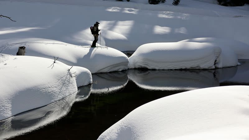 Professional skier John Collinson ski tours around Big Cottonwood Creek while modeling for a Smith Optics photo shoot in Brighton, on Monday, March 13, 2023.